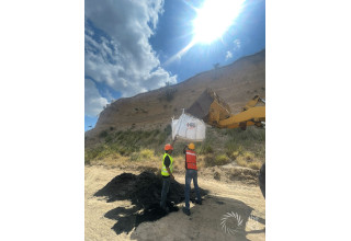 Biochar Application - View of workers unloading biochar supersack