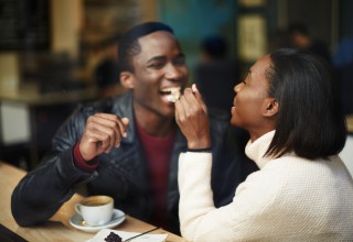 Happy Couple Enjoying Meal Out