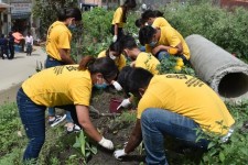 Scientology volunteer ministers cleaning up the area around the sacred river in the center of Kathmandu