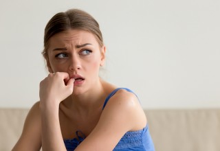 Nervous Woman Biting Her Nails