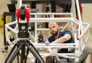 New API vProbe hand-held tactile probing system shown being used with API Radian laser tracker