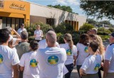 Volunteers gather at the North Greenwood Martin Luther King Community Center to launch a community cleanup.