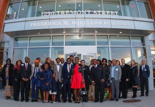 Frederica Williams (center in red), CEO and President of Whittier Street Health Center at building dedication 2018 