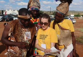 Volunteer Minister introduces tribal chiefs to the Volunteer Ministers booklets containing tools for bettering conditions.