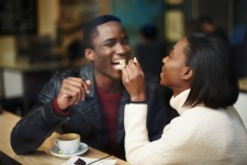 Happy Couple Enjoying Meal Out