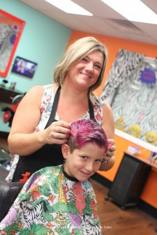 A young client getting his hair styles at Wild Styles