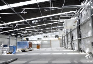 Light Deprivation System on the Inside of One of the Five Greenhouses