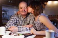 Daughter Thanking Father for Helping with Loans