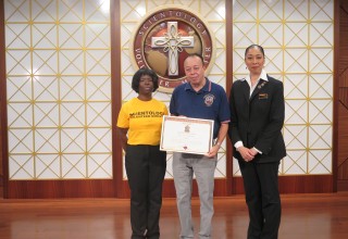 Mr. Israel Miranda of the New York City Emergency Medical Service is presented the Community Leadership Award by the Church of Scientology Harlem. 