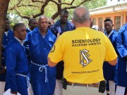 The leader of the African Continental Cavalcade (in yellow)  was guest speaker at this church's Sunday Service. Here  is answering questions from some of the men who attended  his presentation.