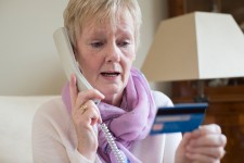 Woman Making a Payment Over the Phone