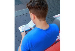 Young man reads the Truth About Drugs booklet