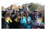 Women participating in the march on the 60th anniversary of the Women's March against the pass laws hold copies of The Way to Happiness—a common sense moral code anyone can use to improve the lives of friends and families.