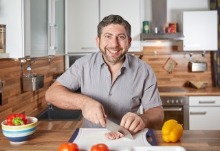 Happy Guy Cooking Alone