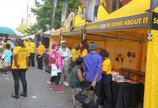 Guests visiting the Volunteer Ministers tent