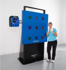 Leslie Brtek Standing next to the SMARTfit Mini