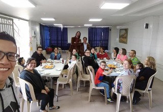 López with some members of his church