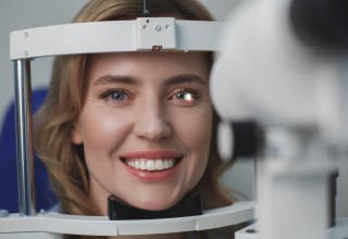 Smiling Woman at Eye Examination