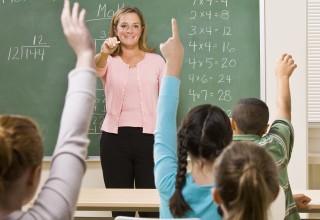 Smiling Teacher in Classroom