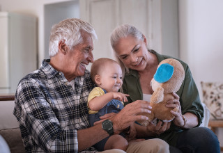 Older adults playing with their grandchild