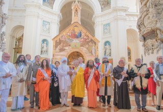 Religious Leaders outside of the Portiuncula within the Basilica of Saint Mary of the Angels, holding the water contained in the heart shaped vessel.