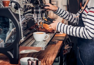 Coffee Shop Worker Making Coffee