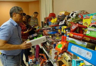 Dr. Norman Quintero collecting Toys for Children in Puerto Rico