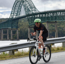 Michael O'Brien Riding Over a Bridge