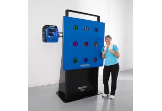 Leslie Brtek Standing next to the SMARTfit Mini