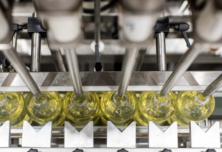 Bottles of Liquid Hand Wash on filling line at Royal Labs