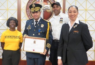 Mr. Juan Gutierrez. Executive Director of La Academia Mundial Bomberos (World Academy of Firefighters) is presented the Community Leadership Award by the Church of Scientology Harlem.