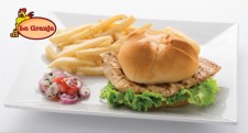 Enjoy a grilled or crispy delicious chicken sandwich at a La Granja restaurant.