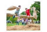 Jousting with burlap bags filled with hay at the Saint Hill Medieval Fayre