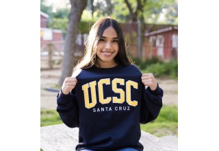 Campbell Scholar proudly wearing her college sweatshirt