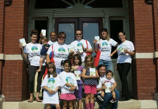 Volunteers set off to hand out copies of The Way to Happiness.