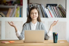 Woman Meditating in Home Office