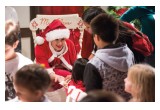 Mrs. Claus helps the children decorate cookies at Winter Wonderland in downtown Clearwater, Florida. 