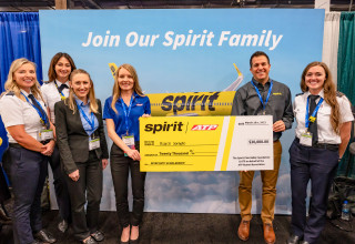 Kayce Sorbello receiving $20,000 scholarship from ATP and Spirit (photo Andrew Zaback/WAI)