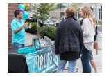 A volunteer from the Seattle chapter of the Foundation for a Drug-Free World briefed neighbors on the purpose and scope of the campaign.